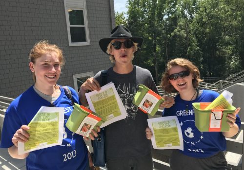 SEC staff holding up fliers for composting